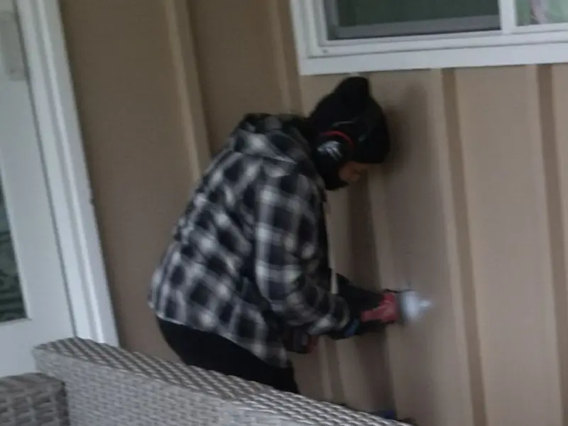 Professional electrician installing an exterior outlet in Kelso