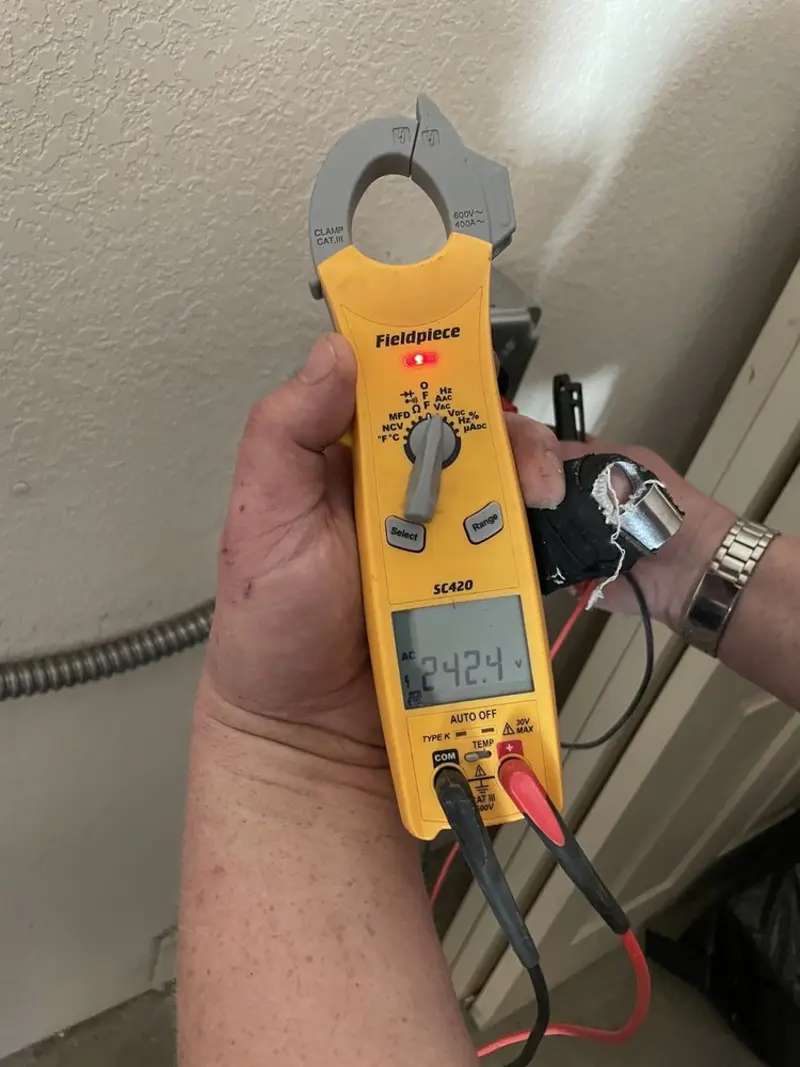 Voltage testing with clamp meter during Outlet Installation in Kelso